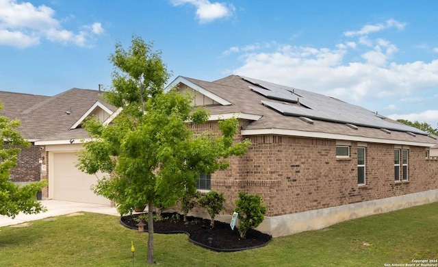 view of property exterior featuring a yard and a garage