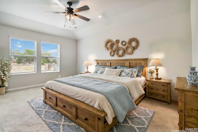 carpeted bedroom with lofted ceiling and ceiling fan