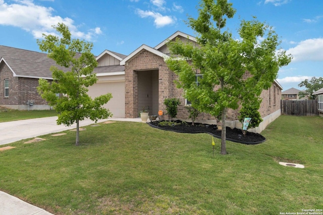 view of front of property featuring a garage and a front lawn