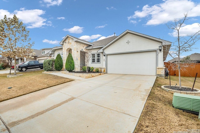 ranch-style house with a garage and a front yard