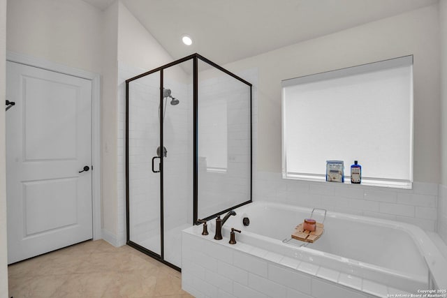 bathroom featuring independent shower and bath and tile patterned flooring