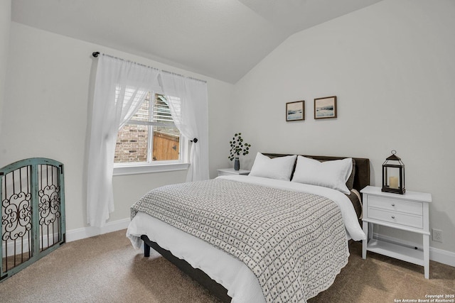 carpeted bedroom with vaulted ceiling