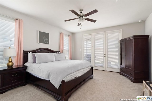 carpeted bedroom with ceiling fan and access to exterior