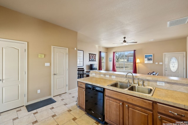 kitchen with dishwasher, sink, and ceiling fan