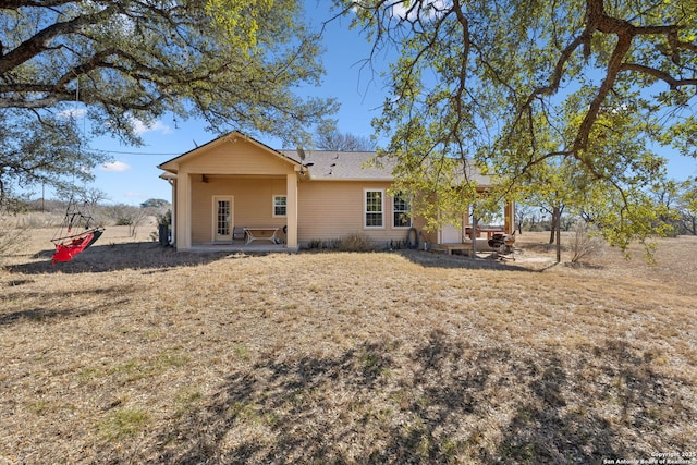 rear view of property featuring a patio area