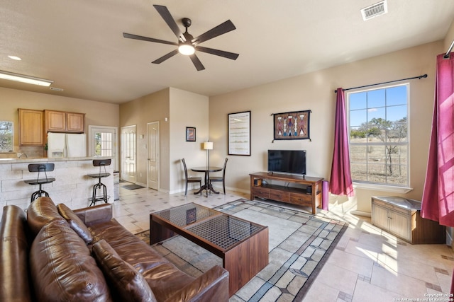 living room featuring ceiling fan