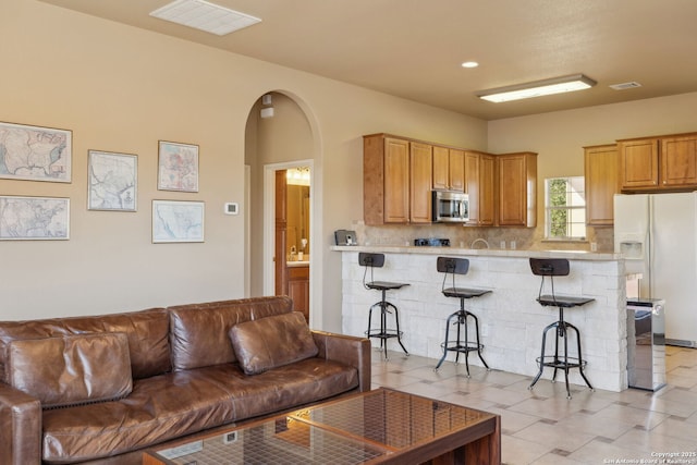 living room with light tile patterned floors