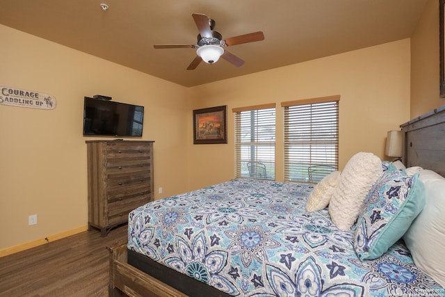 bedroom featuring dark hardwood / wood-style floors and ceiling fan