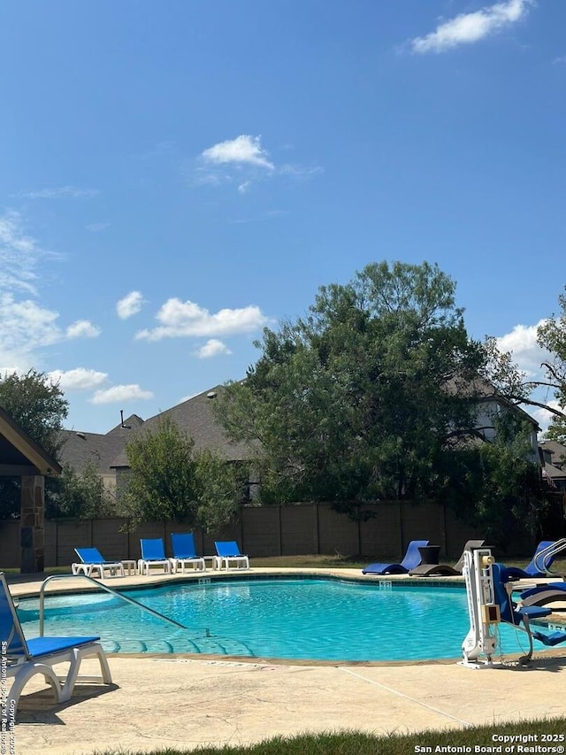 view of pool featuring a patio area