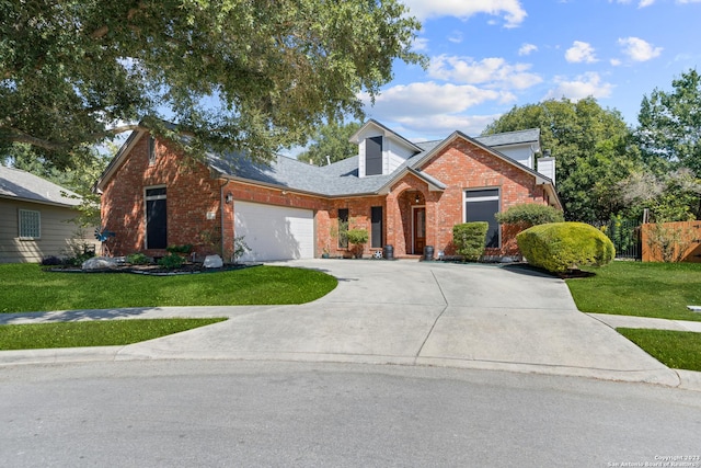 view of front of house with a garage and a front yard