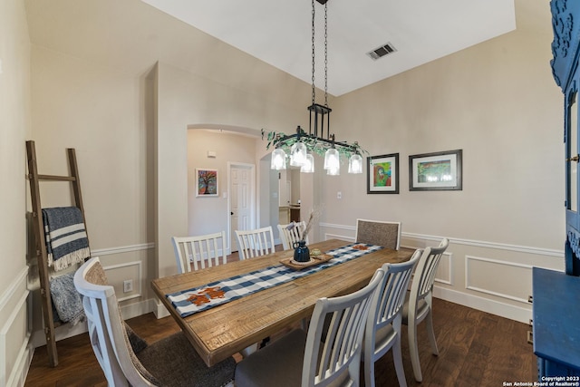 dining room with dark hardwood / wood-style flooring