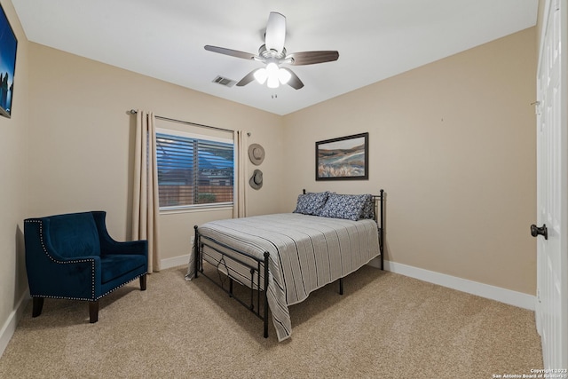 bedroom featuring ceiling fan and light carpet