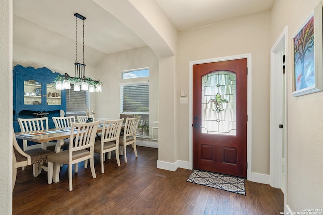 foyer entrance featuring dark wood-type flooring and lofted ceiling