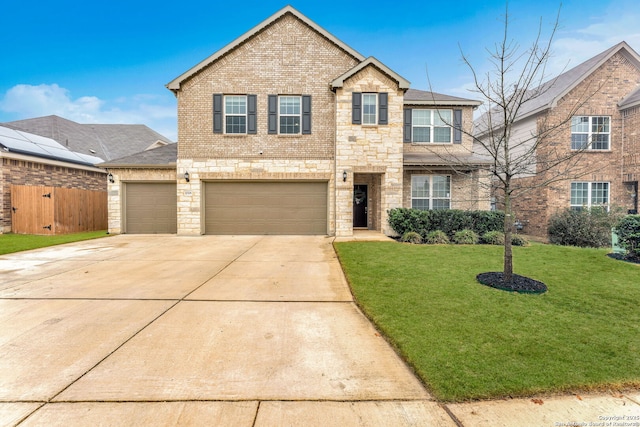 view of front of property with a garage and a front yard