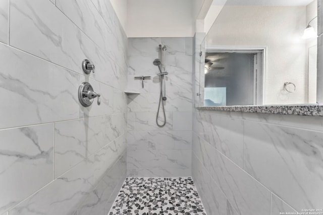 bathroom featuring a tile shower