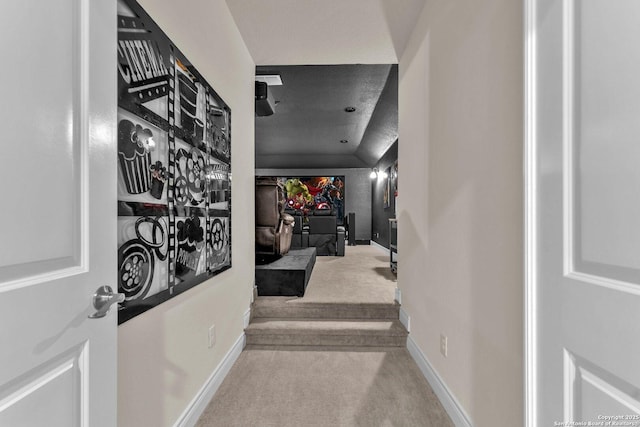 hallway with light colored carpet