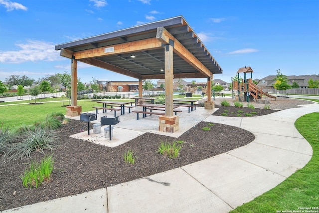 view of home's community with a yard and a playground