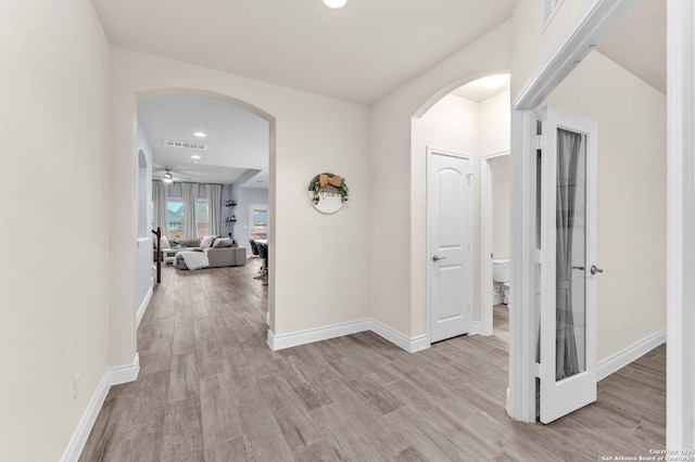 corridor featuring light wood-type flooring