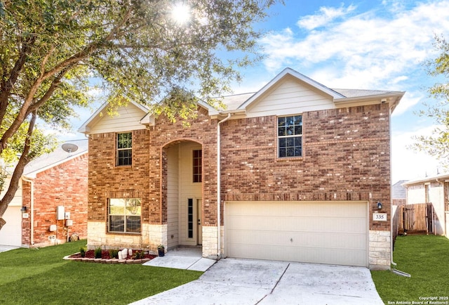 view of front of property with a garage and a front lawn