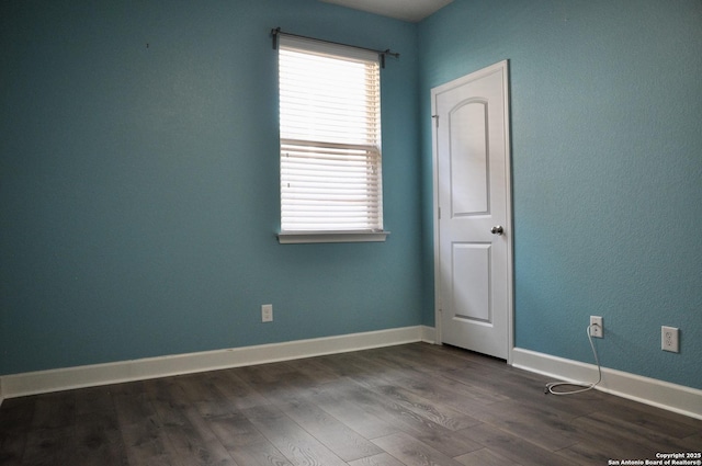 empty room featuring dark hardwood / wood-style floors