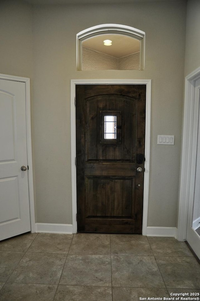 foyer with tile patterned flooring