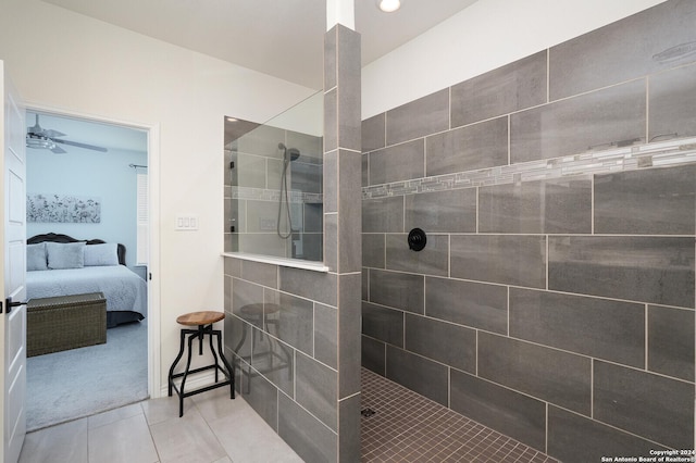 bathroom with ceiling fan, tile patterned floors, and tiled shower