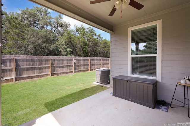 view of yard featuring central AC unit, a patio, and ceiling fan