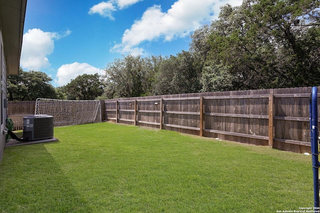 view of yard featuring central AC unit