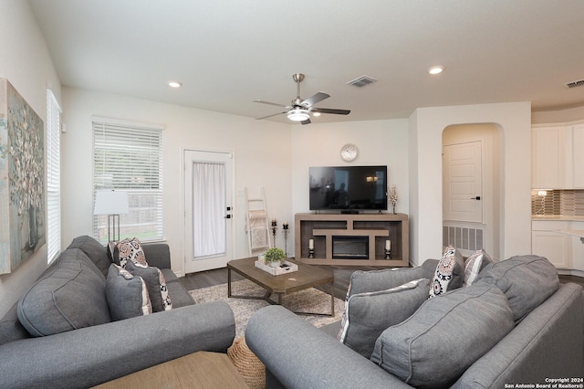 living room with hardwood / wood-style floors and ceiling fan