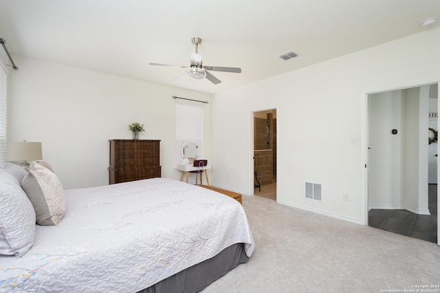 carpeted bedroom featuring ceiling fan and connected bathroom