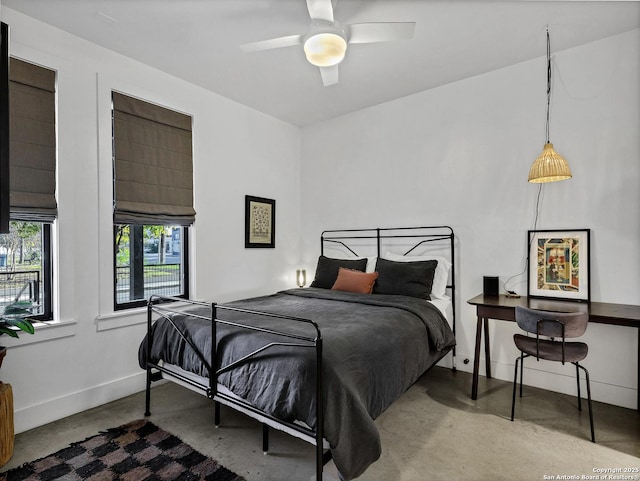 bedroom featuring ceiling fan and concrete flooring