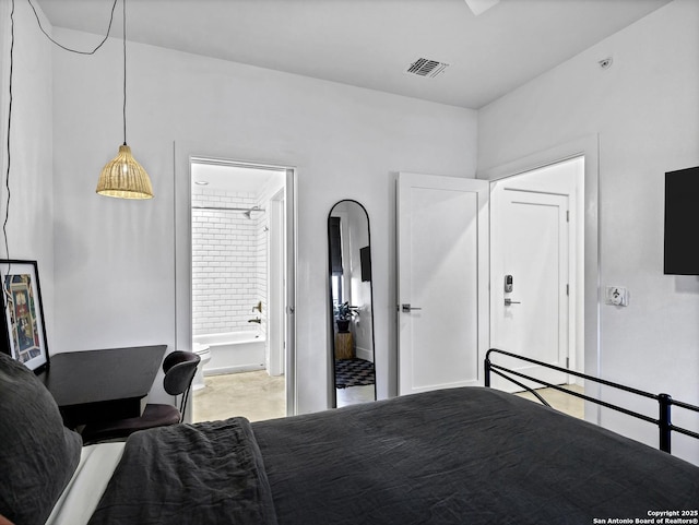 bedroom featuring ensuite bath