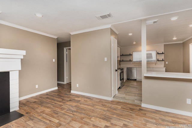 unfurnished living room with crown molding and light hardwood / wood-style flooring