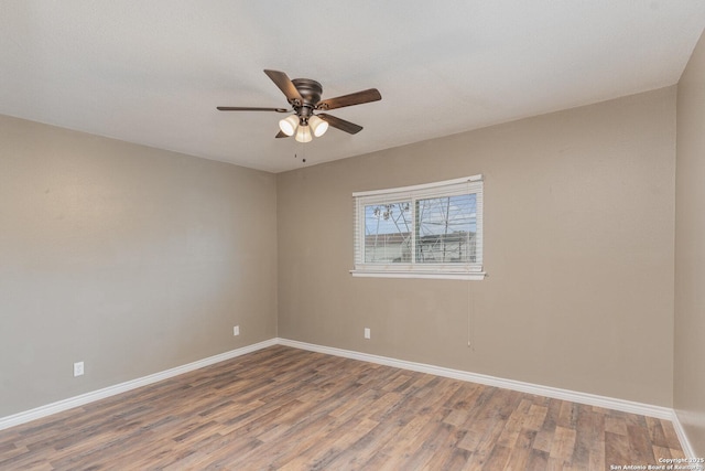 empty room with hardwood / wood-style flooring and ceiling fan