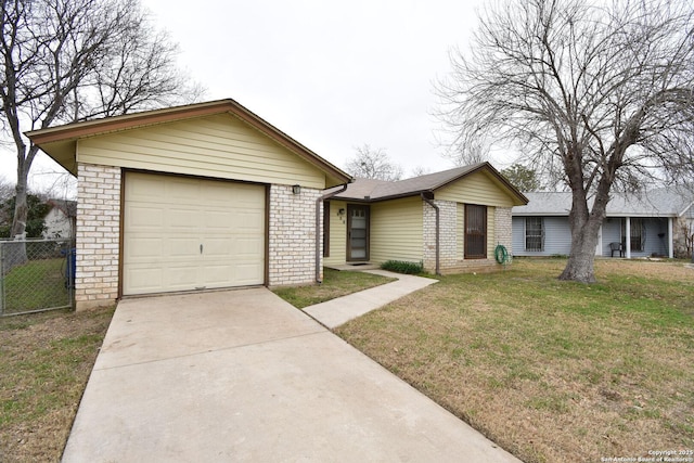 single story home with a garage and a front yard