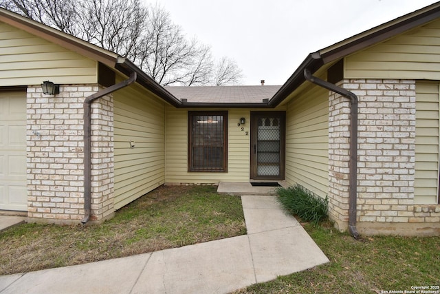 doorway to property featuring a garage