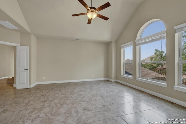 spare room featuring ceiling fan and high vaulted ceiling