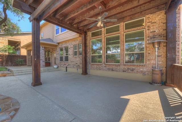 view of patio featuring ceiling fan