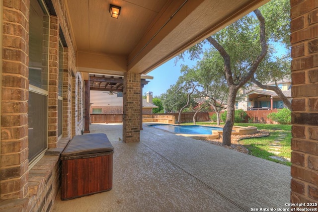 view of patio featuring a fenced in pool