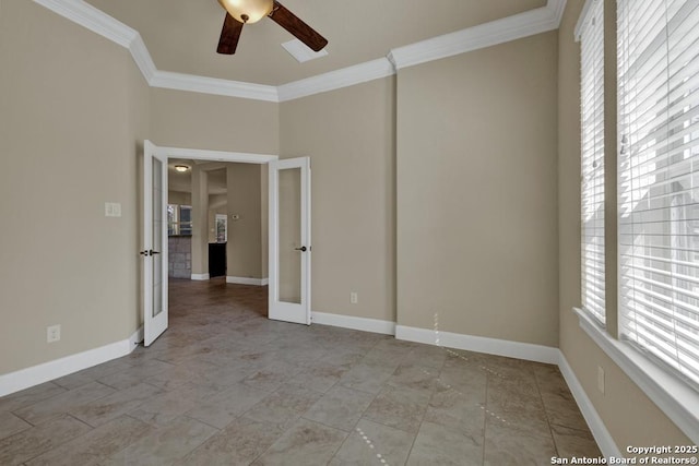 empty room featuring ornamental molding, french doors, and ceiling fan