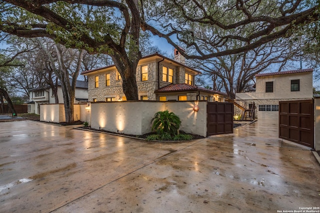 mediterranean / spanish-style home featuring a garage