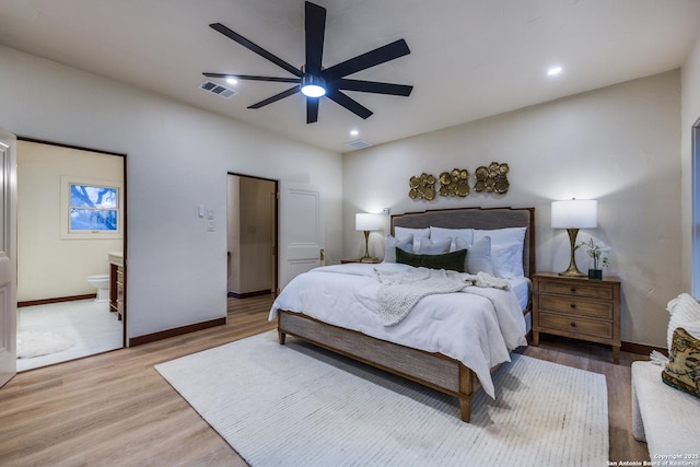 bedroom with wood-type flooring, ceiling fan, and ensuite bathroom