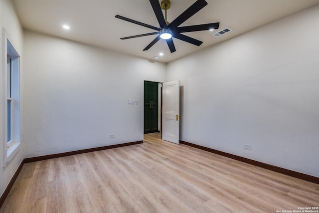 spare room with ceiling fan and light hardwood / wood-style flooring