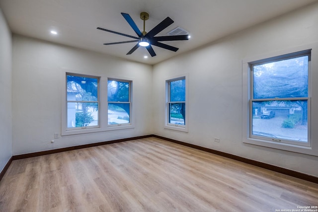 spare room with light hardwood / wood-style floors and ceiling fan