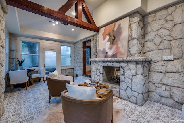 living room with lofted ceiling with beams