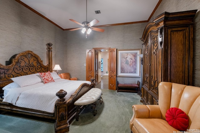 carpeted bedroom featuring crown molding and ceiling fan