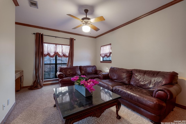 living room with ornamental molding, light colored carpet, and ceiling fan