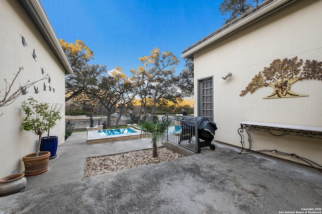 view of patio featuring a fenced in pool