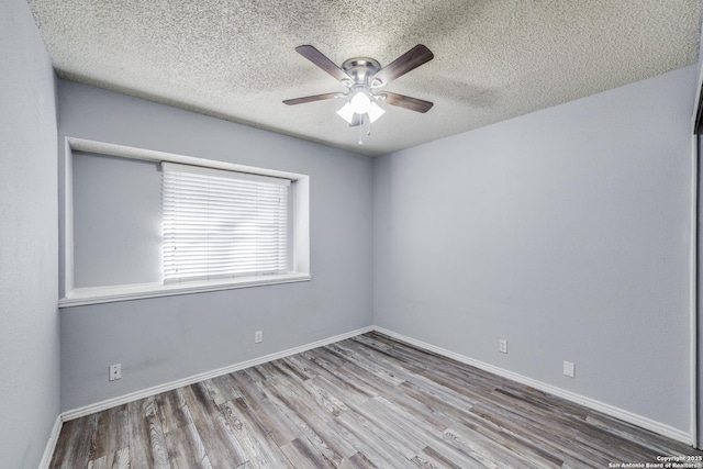 unfurnished room featuring ceiling fan, a textured ceiling, and light wood-type flooring