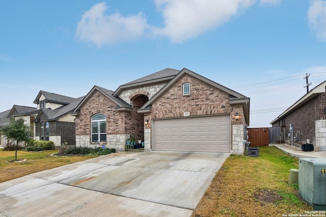 view of front of home featuring a garage and a front lawn